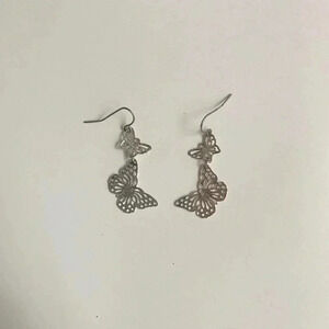 Silver butterfly dangle earrings.